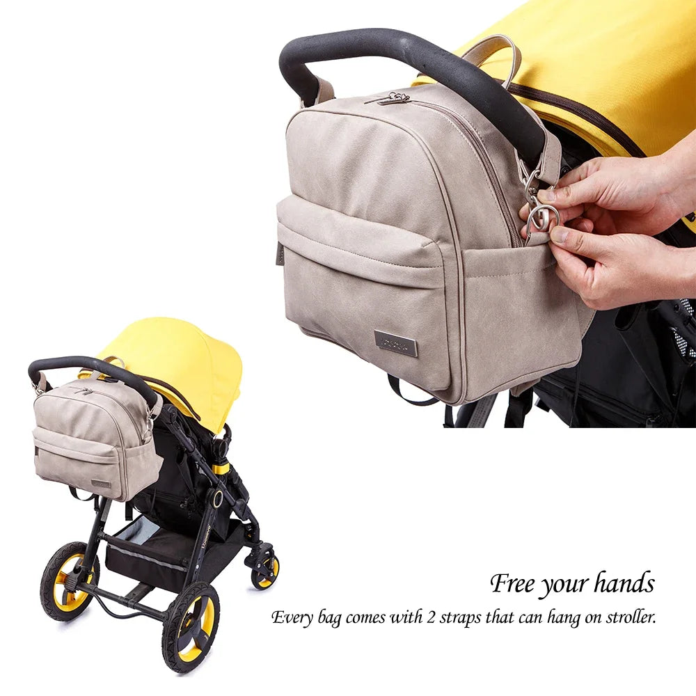 Diaper Bag Backpack by Soboba with Front Zipper Pocket, Top Carry Handle and Solid Color Styling for Baby Care Essentials and Everyday Outings