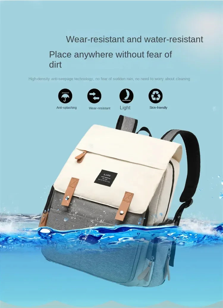 Flap-Top Diaper Backpack with Front Storage Pockets, Two Stroller Hooks and 53 x 34 cm Changing Mat for Baby Essentials and Everyday Parent Outings