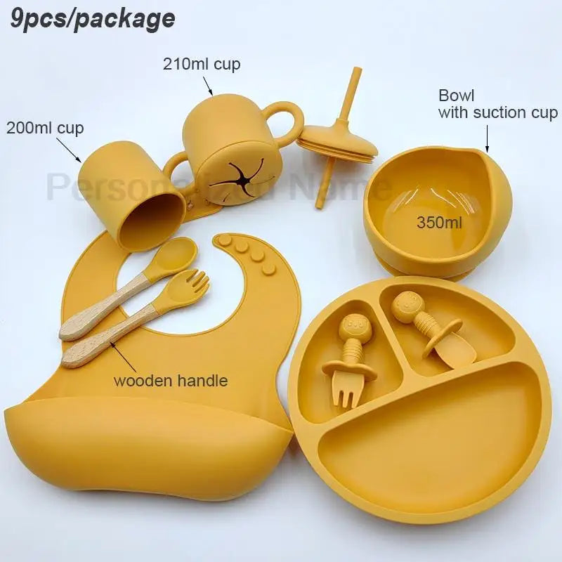 Nine-Piece Personalized Silicone Feeding Set with Suction Bowl, Divided Plate, Pocket Bib, Cups and Utensils for Supervised Baby Mealtimes