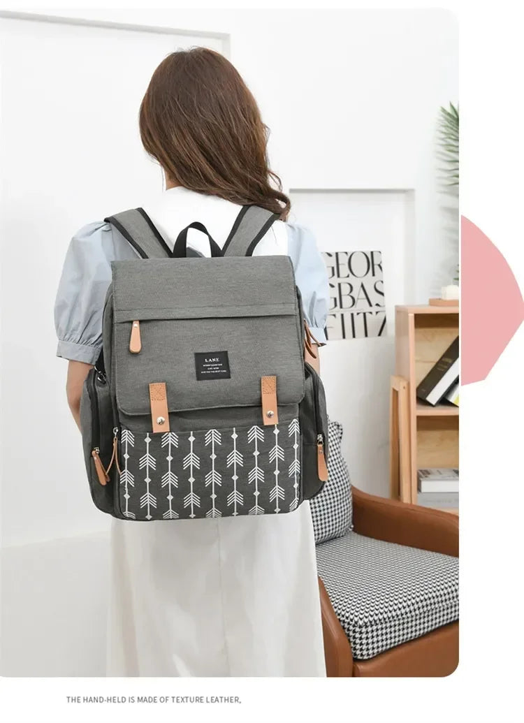 Flap-Top Diaper Backpack with Front Storage Pockets, Two Stroller Hooks and 53 x 34 cm Changing Mat for Baby Essentials and Everyday Parent Outings