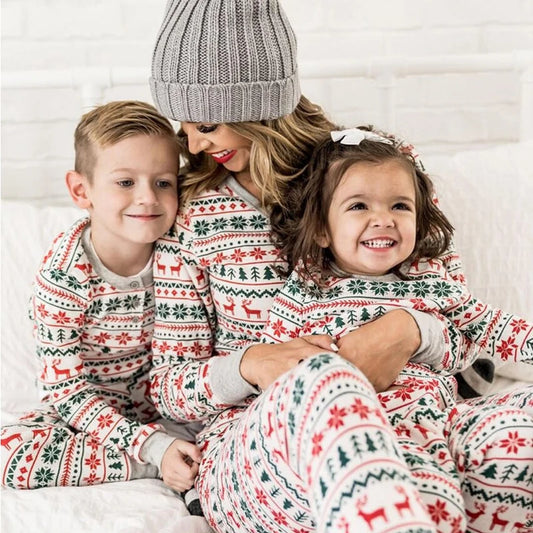 White Fair Isle Family Christmas Pajamas with Red and Green Reindeer, Snowflake and Tree Prints, Matching Holiday Outfits for Parents and Kids