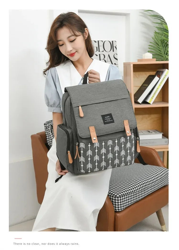Flap-Top Diaper Backpack with Front Storage Pockets, Two Stroller Hooks and 53 x 34 cm Changing Mat for Baby Essentials and Everyday Parent Outings