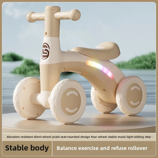 Toddler Ride-On Glider with Four Wheels, Rounded Handlebars and Contoured Seat in Pink or Green for Supervised Foot-Powered Play