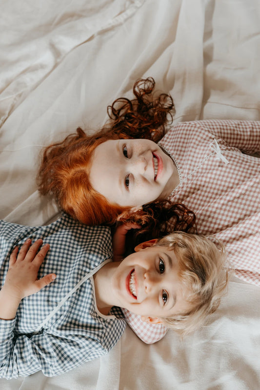 Matching Plaid Pajamas for Kids and Babies, Cotton Long-Sleeve Two-Piece Sets and Footed Rompers in Pink or Blue for Coordinated Sibling Outfits