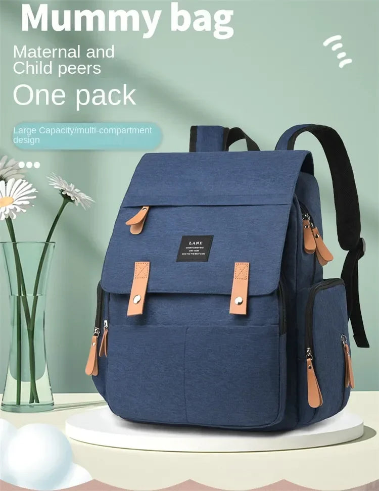 Flap-Top Diaper Backpack with Front Storage Pockets, Two Stroller Hooks and 53 x 34 cm Changing Mat for Baby Essentials and Everyday Parent Outings