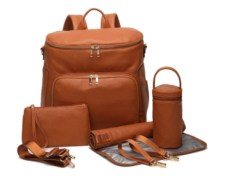 Convertible Diaper Backpack in PU Leather with Changing Pad, 11 Storage Pockets, Insulated Bottle Pockets and Shoulder Straps for Parents