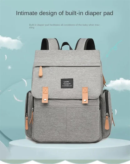 Flap-Top Diaper Backpack with Front Storage Pockets, Two Stroller Hooks and 53 x 34 cm Changing Mat for Baby Essentials and Everyday Parent Outings
