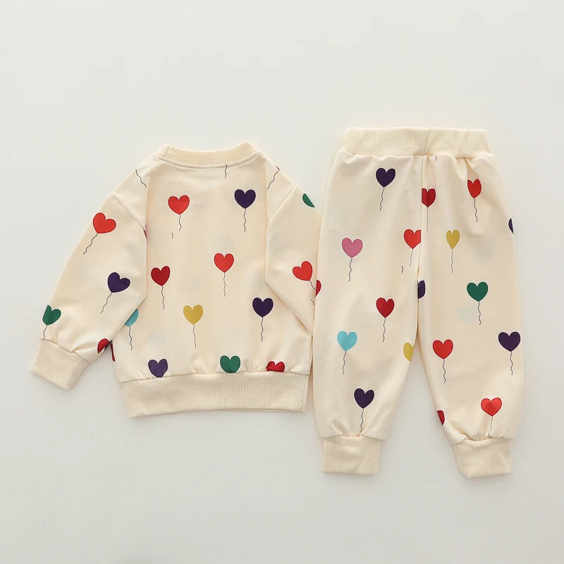 Heart Print Baby Outfit Set with Beige Long Sleeve Crewneck Top and Matching Cuffed Pants, Two-Piece Casual Clothing for Spring and Fall, 3-24M