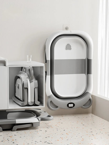 Travel Baby Bathtub with Thermometer and Soft Floating Cushion, Collapsible PP and TPE Bath Tub with Drain Plug for Supervised Infant and Toddler Bathing