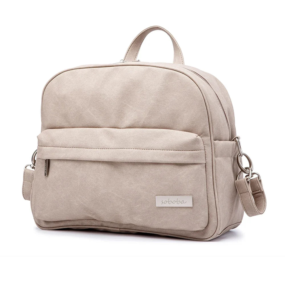 Diaper Bag Backpack by Soboba with Front Zipper Pocket, Top Carry Handle and Solid Color Styling for Baby Care Essentials and Everyday Outings