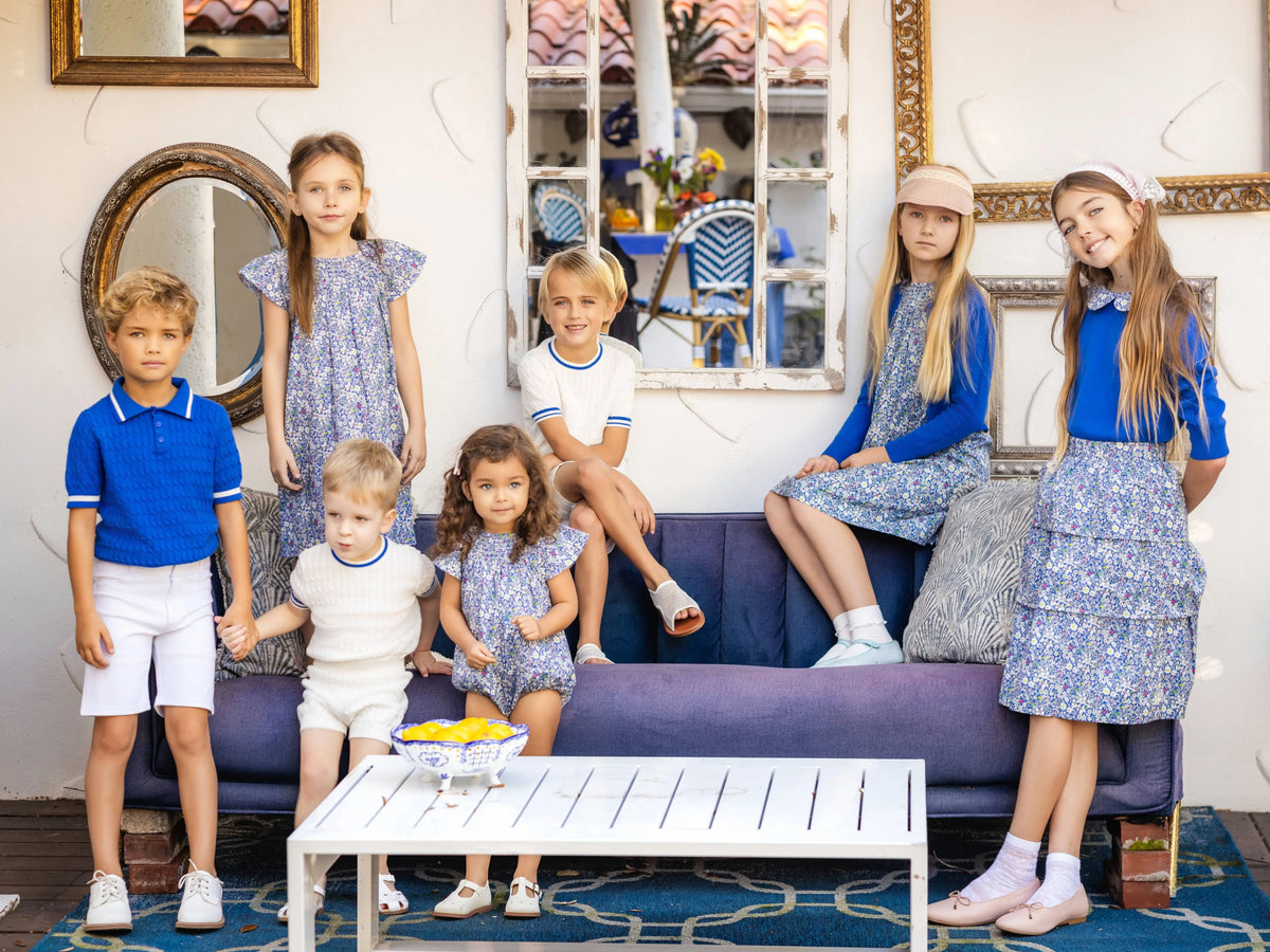 Blue Floral Sibling Outfits with Smocked Girls Dress and Baby Romper Options, Coordinating Boys Knit Tops, Polo and Shorts for Family Photos