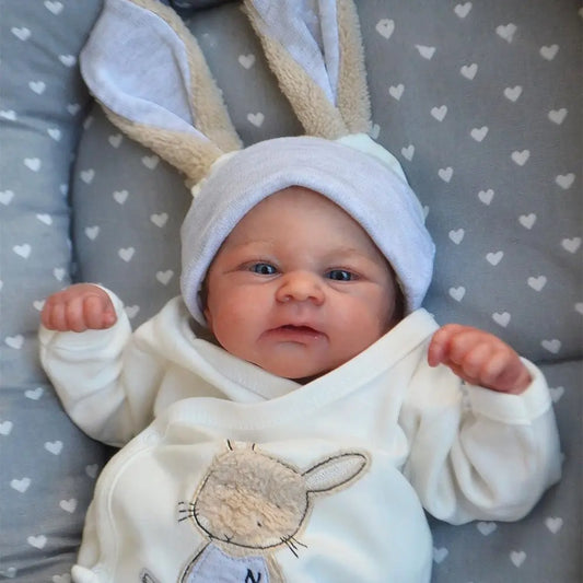 Awake Reborn Baby Doll Elijah, 19-Inch Soft Cloth Body with Hand-Rooted Hair, Layered Painted Details, Bunny Outfit, Bottle and Magnetic Pacifier
